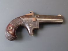 Colt No. 2 .41 rimfire derringer pistol with shaped and chequered grip, engraved decoration,