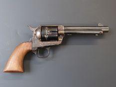 Six shot hammer action Colt style single action replica revolver with shaped wooden grips, frame