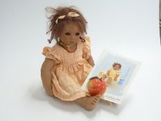 Annette Himstedt Kinder doll Keri 1998, 64cm tall, in original box with related paperwork.