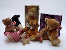 Eight Teddy bears comprising five Merrythought including Millenium, Xmas 2000 and two signed by