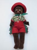 Farnell Alpha black doll with pressed felt face, red felt shorts and hat, check shirt, neckerchief