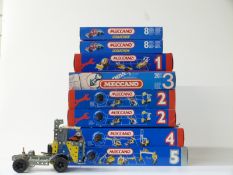 Eight Meccano outfits and sets comprising 1, 2x2, 3, 4, 5 and 3910 x 2, all with original boxes with