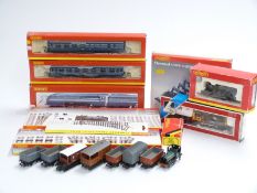 Eighteen Hornby and Lima 00 gauge locomotives, coaches, wagons and accessory packs including LMS 4-
