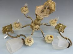 A brass six branch chandelier, together with a pair of brass wall lights with glass shades