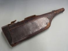 A 19thC 'leg of mutton' leather gun case with brass clasp, length 79 cm