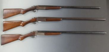 Three 12 bore single barelled shotguns Baikal with chequered grip and forend, sling suspension
