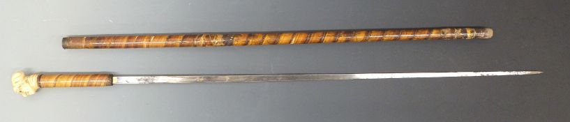 A 19thC swordstick with cased ivory vagabond bust, 86cm, probably Dieppe