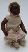 Heubach Koppelsdorf bisque headed black doll with open mouth, weighted brown eyes, and jointed