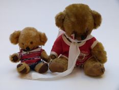 Two Merrythought Cheeky bears one in Manchester United shirt (33cm tall) the other in Gloucester