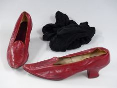 A pair of Victorian red leather shoes with black stockings