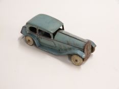 Wells of London clockwork tinplate car with blue body, burgundy decoration, tyres marked 'Balloon