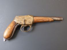 11mm brass framed Martini action pistol with deeply engraved frame, shaped underlever, grips and