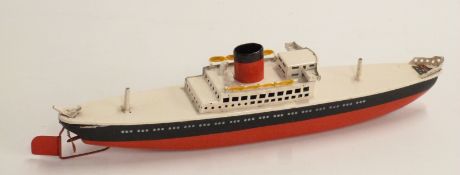 Arnold clockwork tinplate model ocean liner with red and black hull and chimney, white deck and