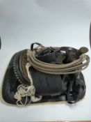 South American western style leather saddle with embossed decoration, stirrups, engraved studs and