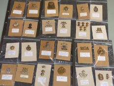 A collection of British Army cap badges / collar badges to include 5th Dragoon Guards, Devonshire