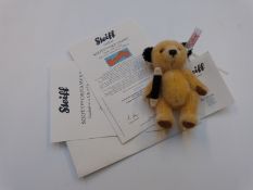 Steiff Teddy bear Sooty with yellow mohair and magic wand, limited edition 292/2000, 11cm tall, in