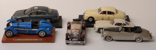 Six Maisto, Burago and Solido large scale diecast model cars including Bugatti, Jaguar, Mercedes