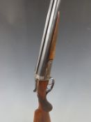 Foreign 12 bore side by side shotgun with engraved lock, top plate and thumb lever, chequered semi-