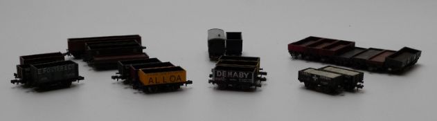 Twenty-four PECO and Graham Farish N gauge wagons together with a Vari-Kit white metal loco body, in