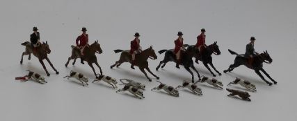 Sixteen Britains cast metal figures and hounds forming a hunting scene
