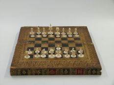 Late 19thC carved ivory chess set, all natural in colour, half with red decoration to bases in
