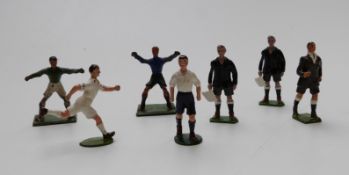 Seven Britains lead model football players comprising a referee, two linesmen, two goalkeepers and