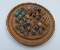 Thirty-six handmade glass marbles all with multi-coloured latticino and spiralling decoration,