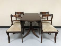 A mahogany drop leaf pedestal table and four chairs
