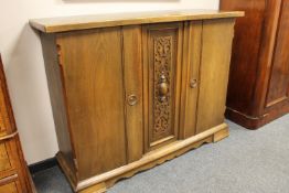 An oak triple door sideboard
