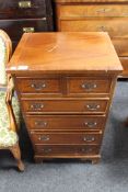 A reproduction mahogany six drawer chest