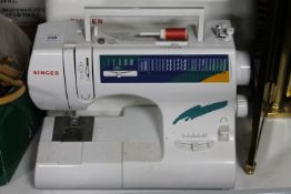 A Singer electric sewing machine (no foot pedal)