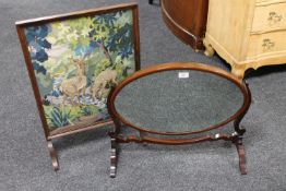 An antique mahogany dressing table mirror together with an oak framed tapestry fire screen