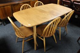 An elm Ercol extending table with leaf and five dining chairs CONDITION REPORT: The