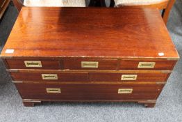 A mahogany seven drawer campaign style chest with brass drop handles CONDITION REPORT: