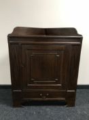 An early 20th century mahogany corner cupboard
