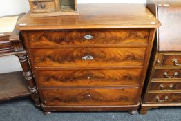 A late nineteenth century mahogany four drawer chest on bun feet CONDITION REPORT:
