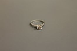 A platinum diamond solitaire ring, approximately 0.72ct, size H.