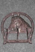 A cast iron horse head hook