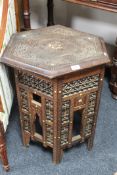 An antique carved hardwood eastern table
