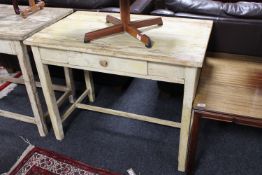 A distressed pine kitchen work table fitted a drawer