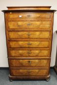 A continental walnut seven drawer chest CONDITION REPORT: Numerous small veneer