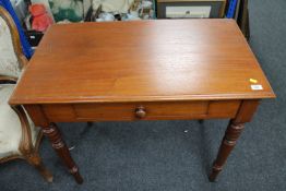An antique mahogany side table fitted with a drawer