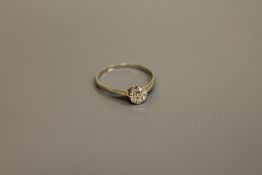 An 18ct white gold diamond solitaire ring, approximately .5ct, size N/O.