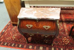 A continental ormolu mounted bombe two drawer chest
