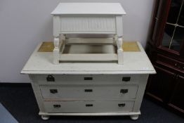 An early 20th century painted oak three drawer chest and a storage stool