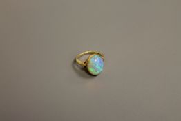 A fine quality opal ring set in 18ct gold, size K.