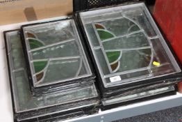 Ten framed stained glass windows