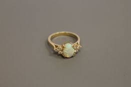 An 18ct gold opal and diamond ring,