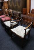 A pair of Victorian mahogany balloon backed chairs together with a pair of mahogany armchairs