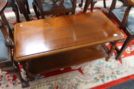 An Ernest Menard mahogany two tier coffee table